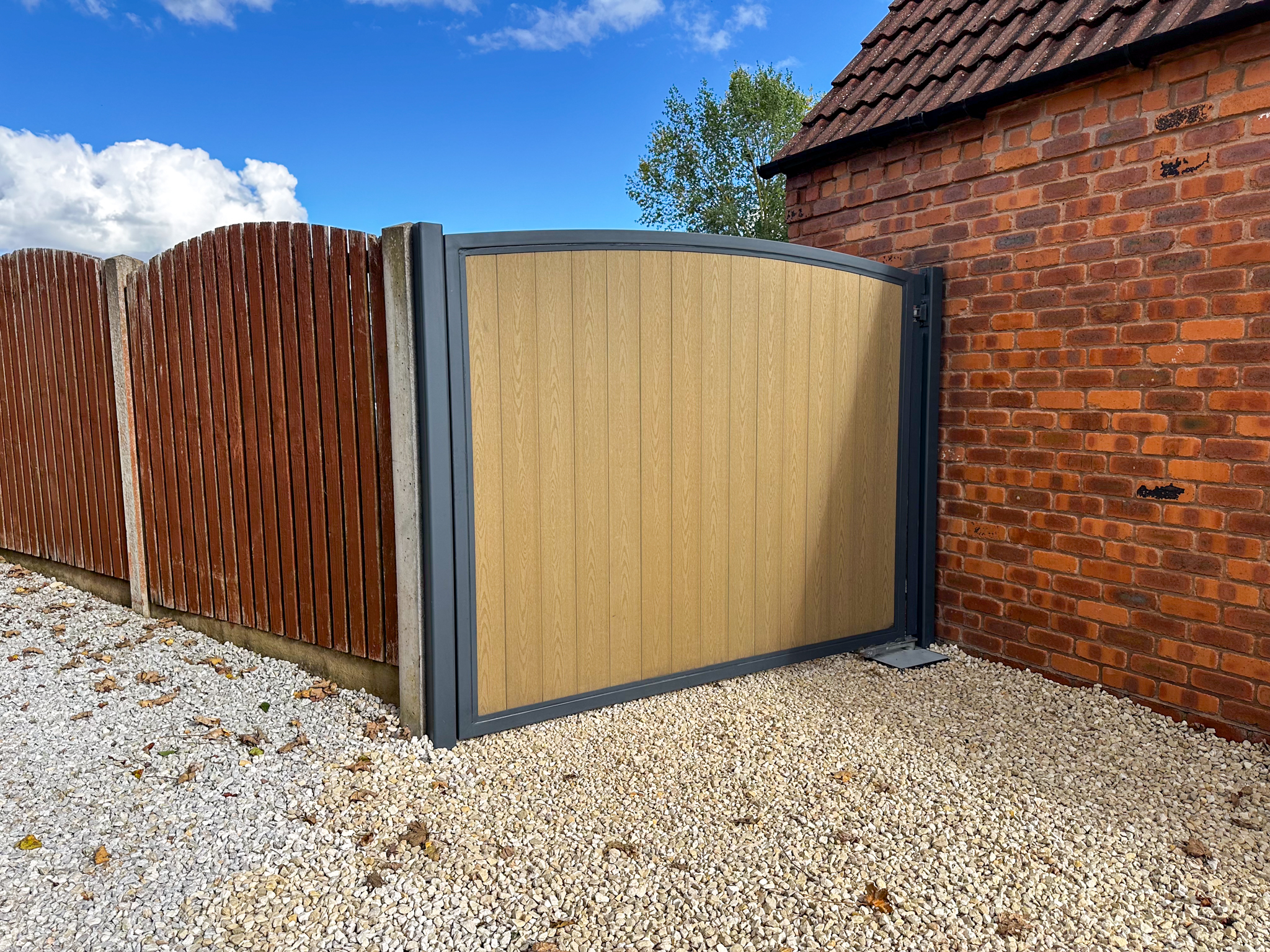 arch-top-sliding-composite-driveway-gate-made-to-measure